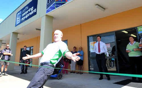 Self Sufficent Homes’ Mark McClurg breasted a green ribbon for the opening of the business. Self Sufficent Homes’ Mark McClurg breasted a green ribbon for the opening of the business.